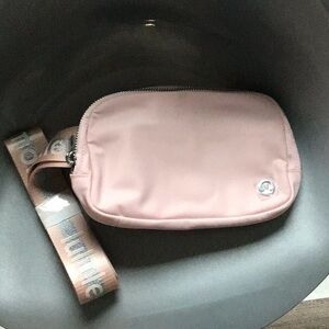 lululemon athletica small crossbody pouch in light pink with beige strap